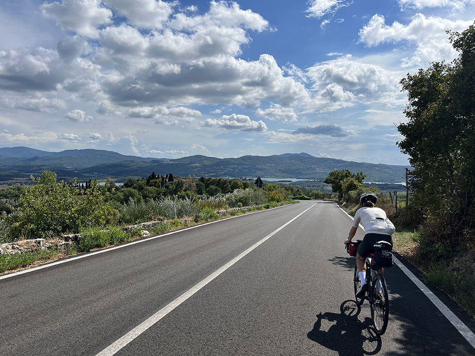 Cyclist road lake hills of Italy