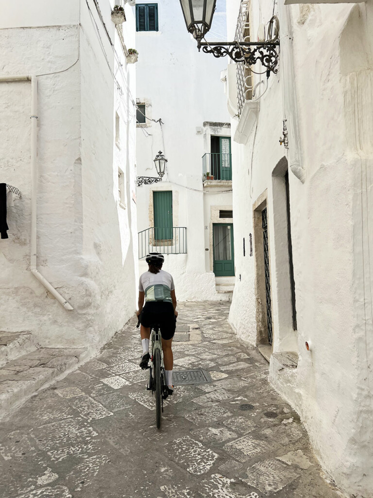 white alley village of Apulia cyclist